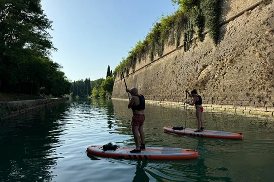 Sup experience with a ride to Peschiera del Garda Lake Garda