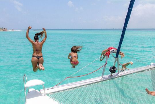 Catamaran Sailing to Isla Mujeres in Stunning Caribbean Waters