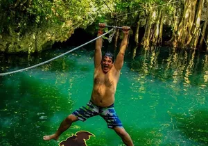 Adrenaline day driving ATV’s doing Ziplines and swimming in a Cenote from Cancun