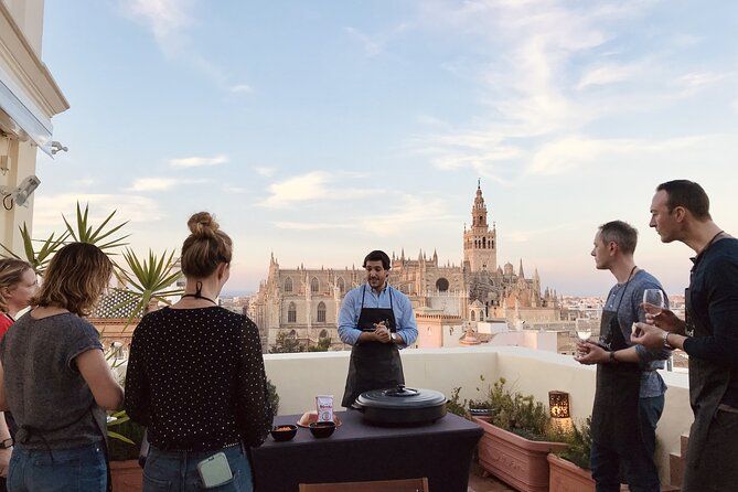 Seville: Small Group Rooftop Paella Class with Sangria Pairing