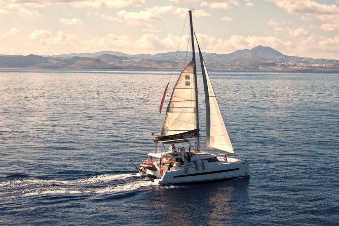 Hersonissos: Luxury Sunset Catamaran Cruise Sushi & Open Bar