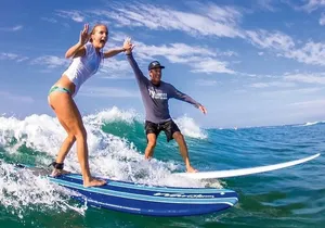 Surf with ALOHA SURF SCHOOL