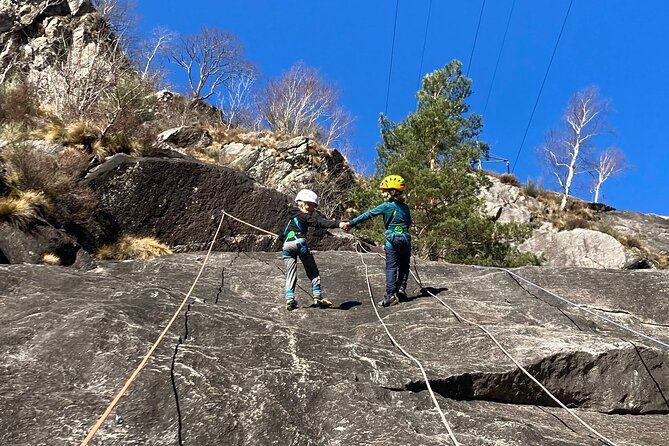 Family rock climbing near Locarno