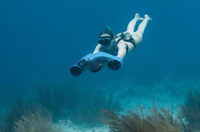 Snorkeling with sea scooters and scenic boat ride