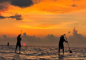 Sunrise Stand Up Paddle activity on a privileged beach.