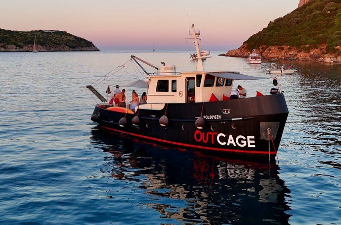 Golfo Aranci sunset on luxury yacht with dolphins and aperitif
