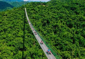 Cross the vehicle bridge with waterfall in RZR ATV