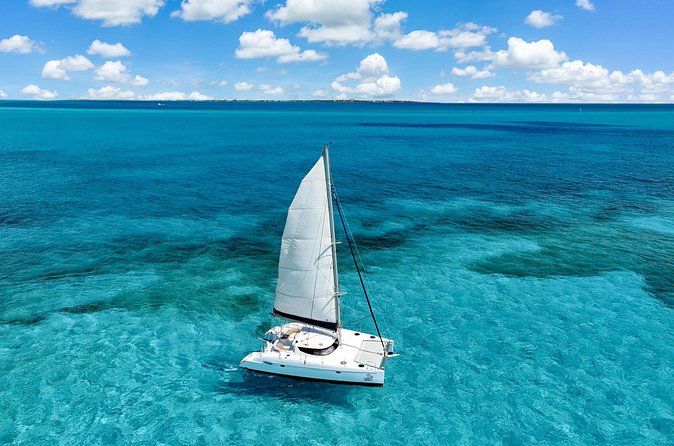 Afternoon Catamaran to Isla Mujeres: Snorkel, Open Bar & Sunset