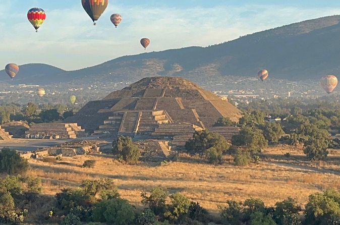 Balloon sunrise over Teotihuacan and Basilica pyramids